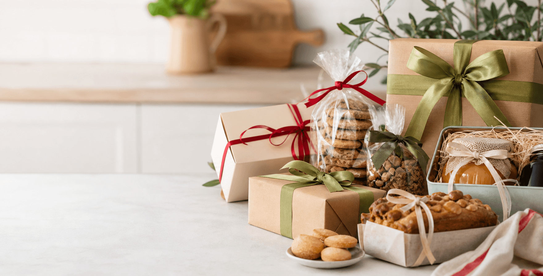 Assorted unlabeled food gift packages on a clean table